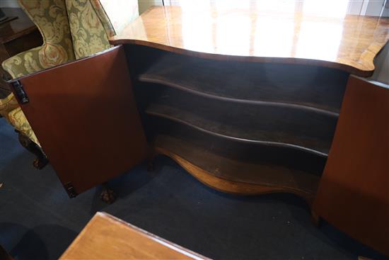 A late 19th century French marquetry inlaid serpentine commode, W.3ft 10in. D.1ft 8in. H.2ft 8.5in.